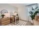 This Bedroom shows a crib, decor lamps, and light coming in through the window at 15782 W Kendall St, Goodyear, AZ 85338