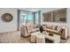 Inviting living room featuring stylish furniture, neutral tones, and plenty of natural light at 15782 W Kendall St, Goodyear, AZ 85338