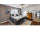 A comfortable bedroom with a modern bed frame, complemented by stylish decor and soft natural light at 16103 W Redfield Rd, Surprise, AZ 85379