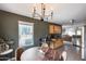 Inviting dining space featuring modern lighting, views to the outside, and an open flow to other living areas at 16103 W Redfield Rd, Surprise, AZ 85379