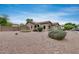 Charming single-story home with desert landscaping and an American flag displayed at 16103 W Redfield Rd, Surprise, AZ 85379