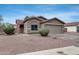 Charming single-story home with desert landscaping and an American flag displayed at 16103 W Redfield Rd, Surprise, AZ 85379