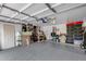 Spacious garage with epoxy floors, ample storage, overhead lighting, and organization at 16103 W Redfield Rd, Surprise, AZ 85379