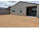 New home with an unfinished backyard and covered patio at 17409 W Eva St, Waddell, AZ 85355