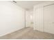 Bright bedroom with neutral carpet and a closet with sliding doors at 17409 W Eva St, Waddell, AZ 85355