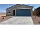 Charming single-story home with a two-car garage, well-maintained landscaping, and a welcoming facade at 17409 W Eva St, Waddell, AZ 85355