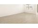 Open living room featuring tiled floors and a window providing natural light at 17409 W Eva St, Waddell, AZ 85355