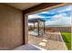 Fully landscaped backyard including a pergola, artificial turf, and desert landscaping at 17532 W Copper Ridge Dr, Goodyear, AZ 85338