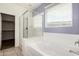 Bright bathroom with soaking tub and glass shower at 17532 W Copper Ridge Dr, Goodyear, AZ 85338