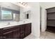 Bathroom with double sink vanity and walk-in closet at 17532 W Copper Ridge Dr, Goodyear, AZ 85338