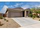 Single-story home featuring low-maintenance desert landscaping, and a two-car garage at 17532 W Copper Ridge Dr, Goodyear, AZ 85338