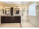 Beautiful bathroom featuring double sinks, granite countertop, a soaking tub and a walk-in shower at 18171 W Marshall Ln, Surprise, AZ 85388