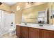 Bathroom with double sinks, a large mirror, and a separate bathtub and shower at 18171 W Marshall Ln, Surprise, AZ 85388