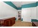 Bright bedroom with a closet, base molding, and decorative trim on the upper walls at 18171 W Marshall Ln, Surprise, AZ 85388