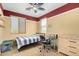 Bright bedroom with a ceiling fan and natural light from the window and modern ceiling fan at 18171 W Marshall Ln, Surprise, AZ 85388