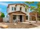Attractive two-story home with a stone-accented porch and a well-manicured front yard at 18171 W Marshall Ln, Surprise, AZ 85388