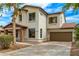 Beautiful two-story home with a stone-accented entry and a spacious driveway leading to a two-car garage at 18171 W Marshall Ln, Surprise, AZ 85388