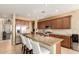 Spacious kitchen with a granite island, stainless steel appliances, and ample cabinet space at 18171 W Marshall Ln, Surprise, AZ 85388