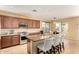 Well-equipped kitchen featuring granite countertops, stainless steel appliances, and barstool seating at 18171 W Marshall Ln, Surprise, AZ 85388
