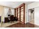 Home office space with hardwood floors, built-in shelving, and a comfortable workspace at 18171 W Marshall Ln, Surprise, AZ 85388