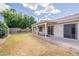 Relaxing backyard featuring a covered patio and well-maintained lawn at 1821 N 74Th Pl, Mesa, AZ 85207