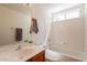 Bathroom featuring a tub and shower combo and updated sink at 1821 N 74Th Pl, Mesa, AZ 85207