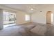 Spacious bedroom with a ceiling fan and access to the backyard at 1821 N 74Th Pl, Mesa, AZ 85207