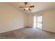 Bright bedroom featuring a ceiling fan and sliding door to backyard at 1821 N 74Th Pl, Mesa, AZ 85207