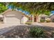 Charming single-story home with desert landscaping and a two-car garage at 1821 N 74Th Pl, Mesa, AZ 85207