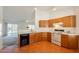 Bright kitchen featuring wood cabinets, white countertops, and an open layout at 1821 N 74Th Pl, Mesa, AZ 85207