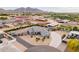 Expansive aerial view of desert home with horse property including stalls, a round pen and lots of parking at 19029 E Mary Ann Way, Queen Creek, AZ 85142