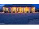 Inviting backyard with a covered patio, comfortable seating, a hammock, and desert landscaping at 19029 E Mary Ann Way, Queen Creek, AZ 85142