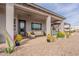 Relaxing covered patio with comfortable seating, desert plants, and a ceiling fan at 19029 E Mary Ann Way, Queen Creek, AZ 85142