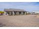 Expansive backyard featuring a covered patio, pergola, desert landscaping, and gravel at 19029 E Mary Ann Way, Queen Creek, AZ 85142