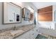 The luxurious bathroom features double vanities, granite countertops, and a soaking tub at 19029 E Mary Ann Way, Queen Creek, AZ 85142