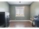 Bedroom featuring desk space, neutral color palette, and a secure safe at 19029 E Mary Ann Way, Queen Creek, AZ 85142
