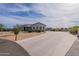 Beautiful single-story home featuring desert landscaping and a long concrete driveway leading to the residence at 19029 E Mary Ann Way, Queen Creek, AZ 85142