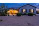 Well-maintained home with desert landscaping, warm lighting, and inviting curb appeal at 19029 E Mary Ann Way, Queen Creek, AZ 85142