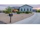 Inviting front exterior with a manicured xeriscaped yard, a modern mailbox, and a circular driveway at 19029 E Mary Ann Way, Queen Creek, AZ 85142