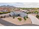 Grey home with stone accents and meticulously landscaped front yard at 19029 E Mary Ann Way, Queen Creek, AZ 85142