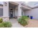 View of front porch with stone columns, seating, desert landscaping, and stylish decor at 19029 E Mary Ann Way, Queen Creek, AZ 85142