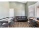 The game room features an air hockey table, love seat, and desk for a variety of activities at 19029 E Mary Ann Way, Queen Creek, AZ 85142