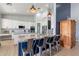 Spacious kitchen with white cabinets, large island and granite countertops at 19029 E Mary Ann Way, Queen Creek, AZ 85142