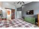 The main bedroom features a barn door leading to the bathroom and a decorative accent wall at 19029 E Mary Ann Way, Queen Creek, AZ 85142