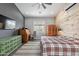 The main bedroom features a ceiling fan, accent wall, and neutral decor with abundant natural light at 19029 E Mary Ann Way, Queen Creek, AZ 85142