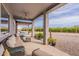 Spacious covered patio featuring stylish outdoor furniture and scenic backyard views at 19029 E Mary Ann Way, Queen Creek, AZ 85142