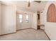 A bedroom with neutral carpet, a ceiling fan, and a built-in desk and storage unit with wooden accents at 1954 N Calle Maderas --, Mesa, AZ 85213