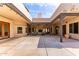 Expansive courtyard with fireplace offers an inviting outdoor living space, perfect for entertaining at 1954 N Calle Maderas --, Mesa, AZ 85213