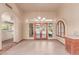 Bright dining room features an elegant chandelier and access to the outdoor patio through french doors at 1954 N Calle Maderas --, Mesa, AZ 85213