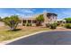 A lovely exterior view showcasing a southwestern style home with a stucco facade and mature landscaping at 1954 N Calle Maderas --, Mesa, AZ 85213